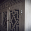 Load image into Gallery viewer, Distress white wash sideboard with glass doors