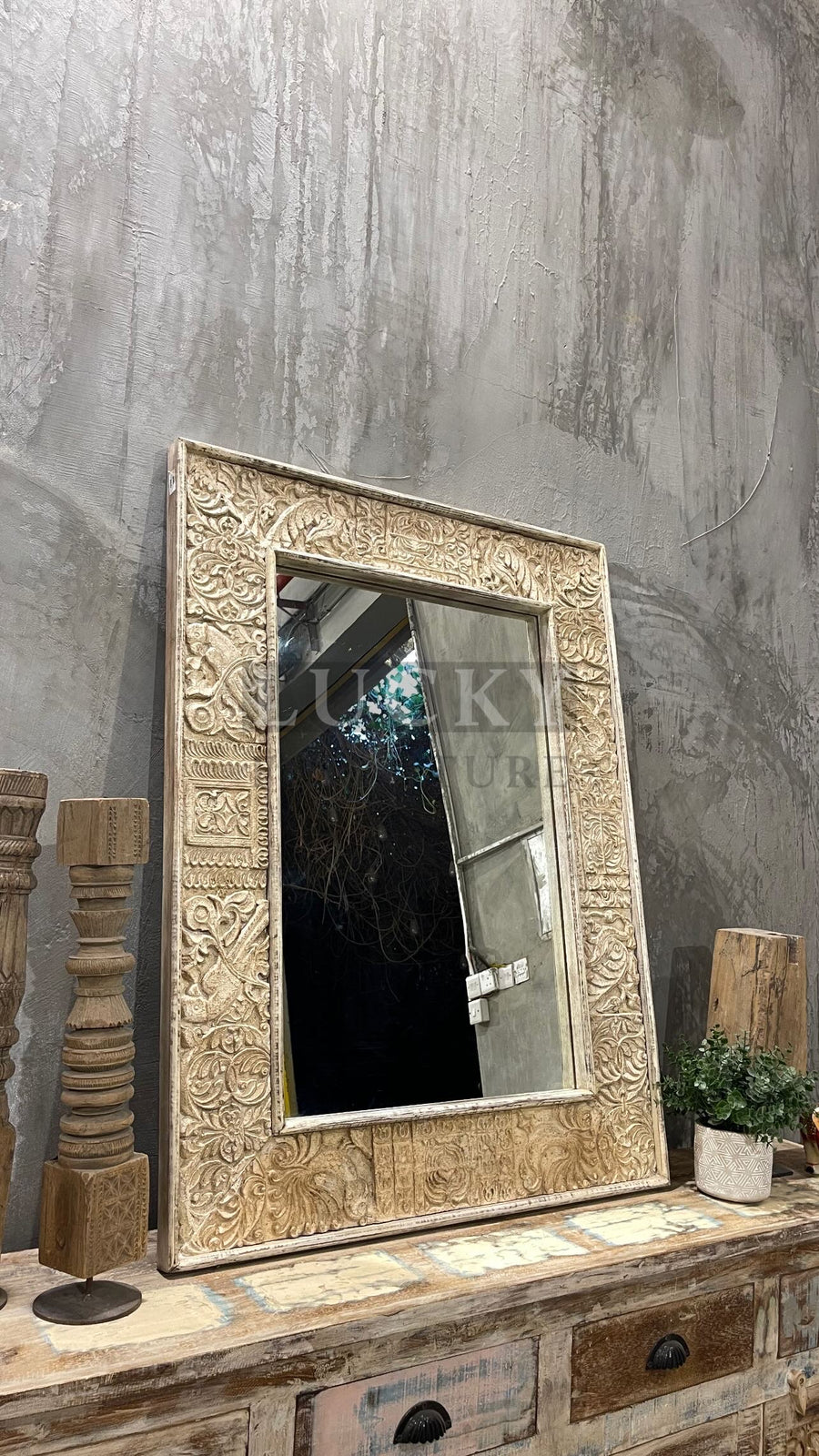 Carved mirror