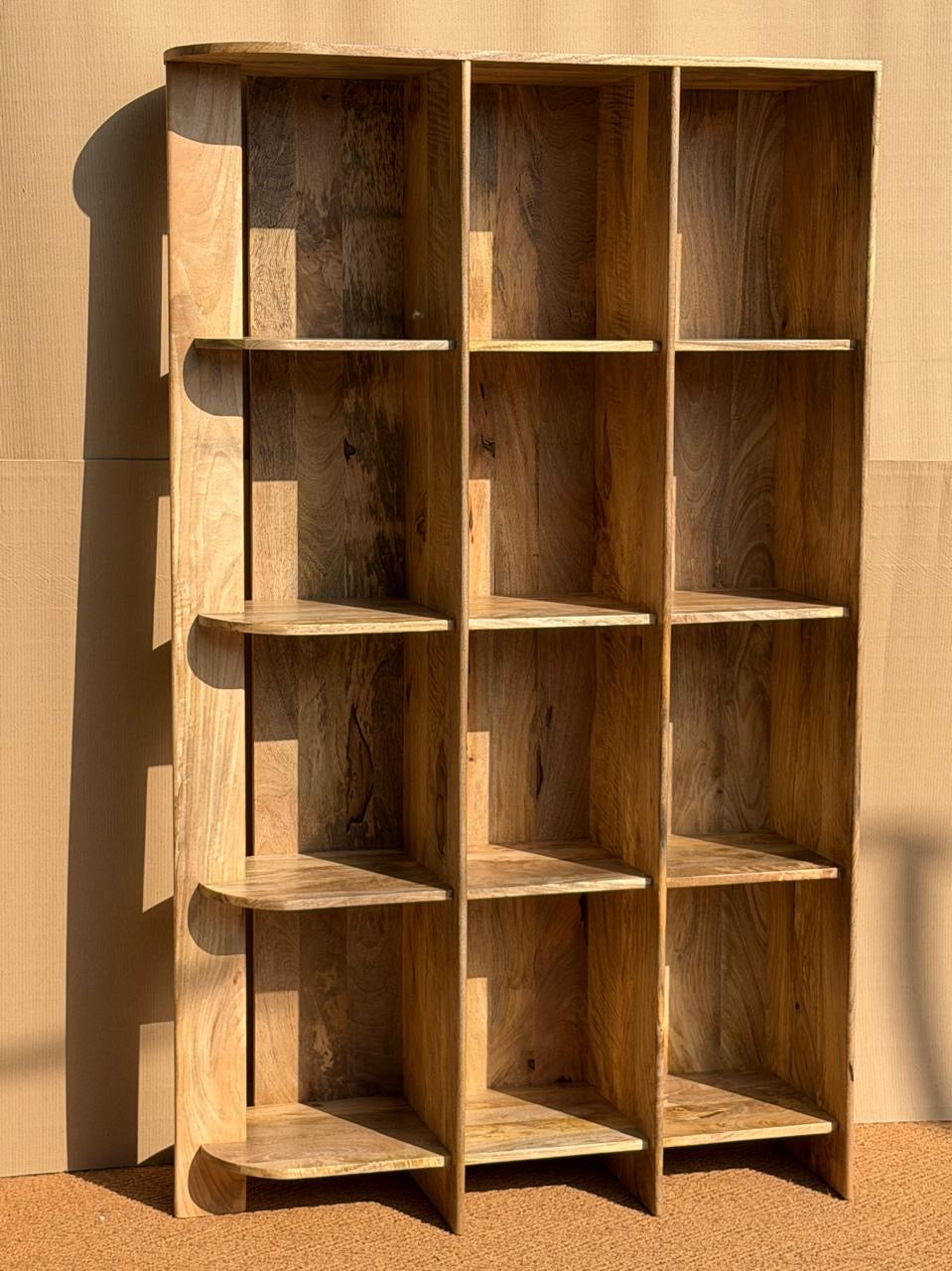 Curved bookshelf.