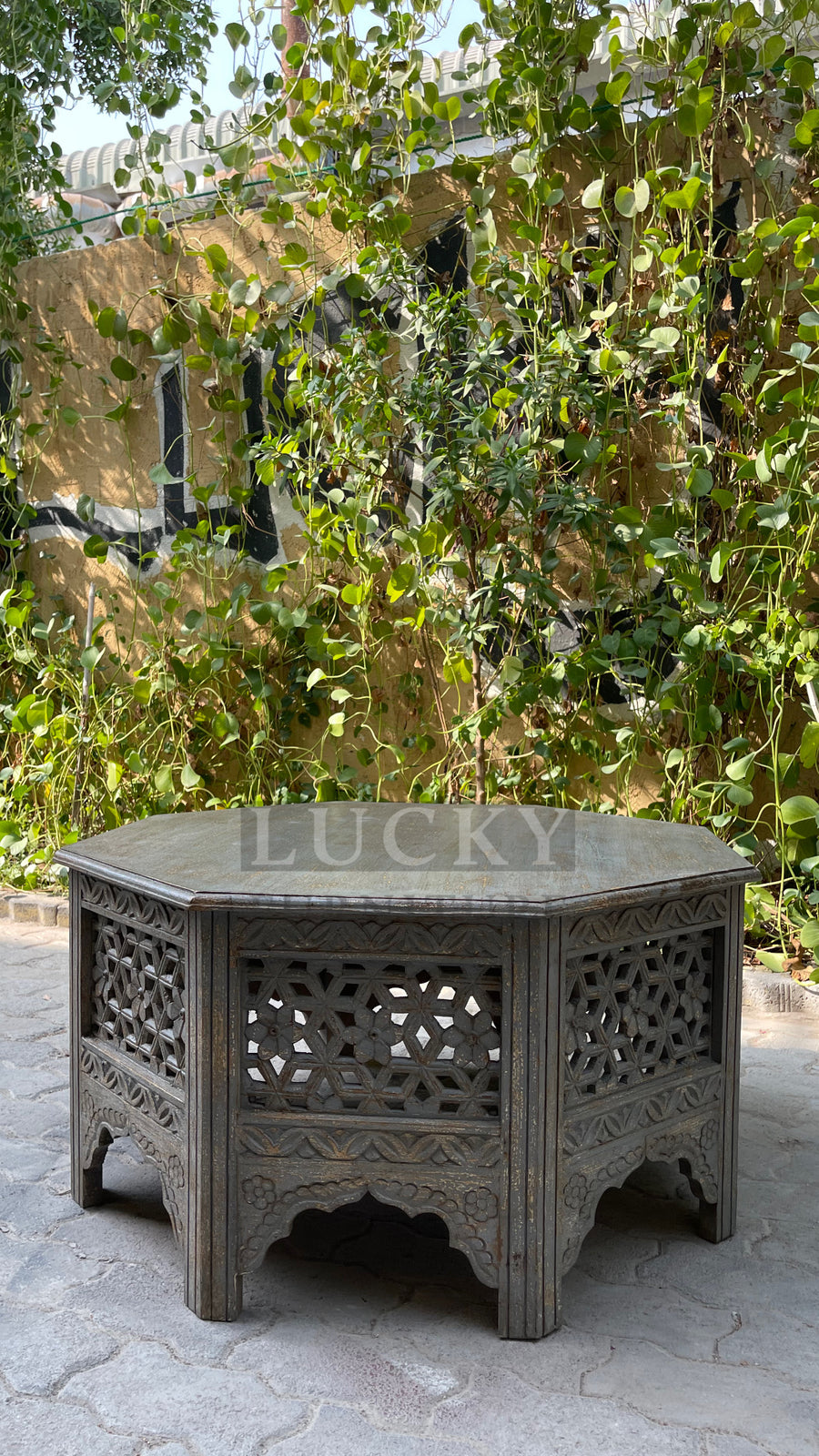 Octagonal carved coffee table