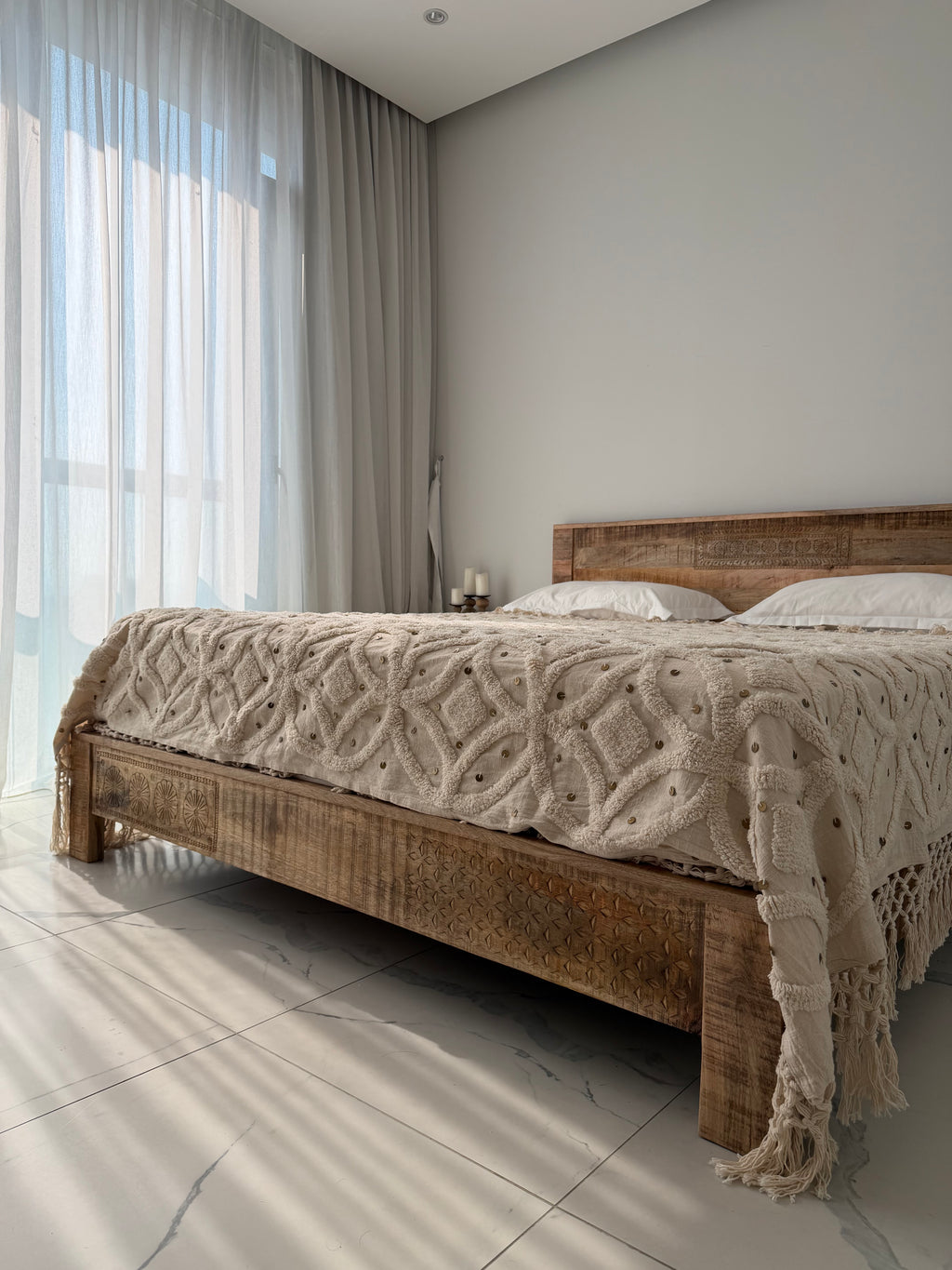 Low headboard carved bed