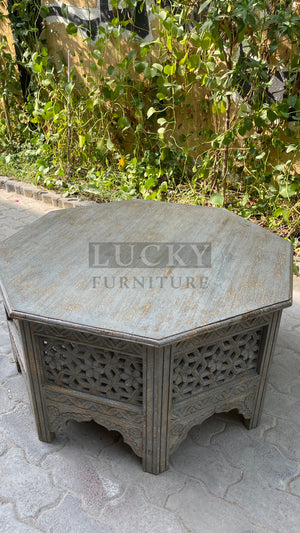 Octagonal carved coffee table