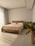 Low headboard carved bed