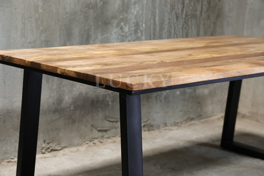 Mango wood metal slant legs table.