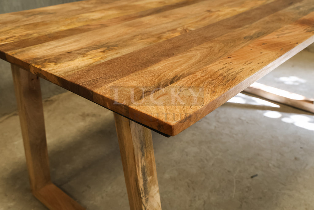 Mango wood slant wooden legs table.