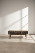 Multi color carved coffee table.