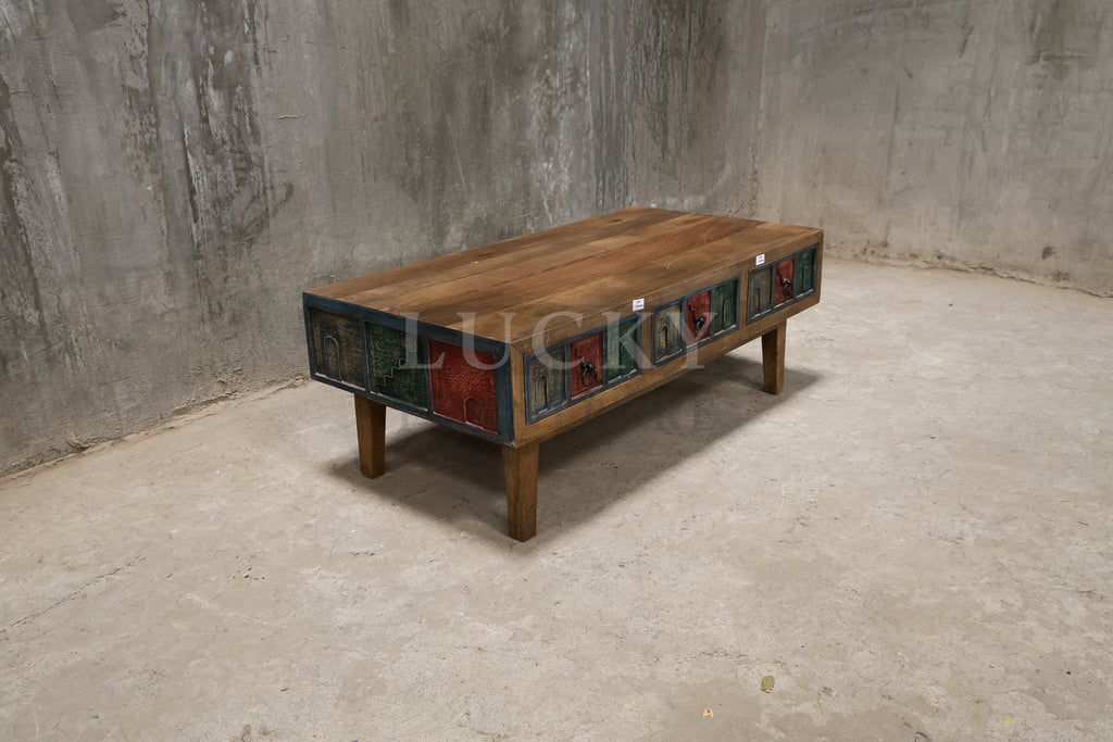 Multi color carved coffee table.