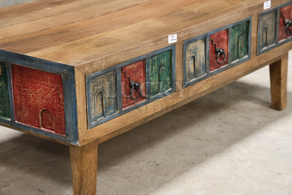 Multi color carved coffee table.