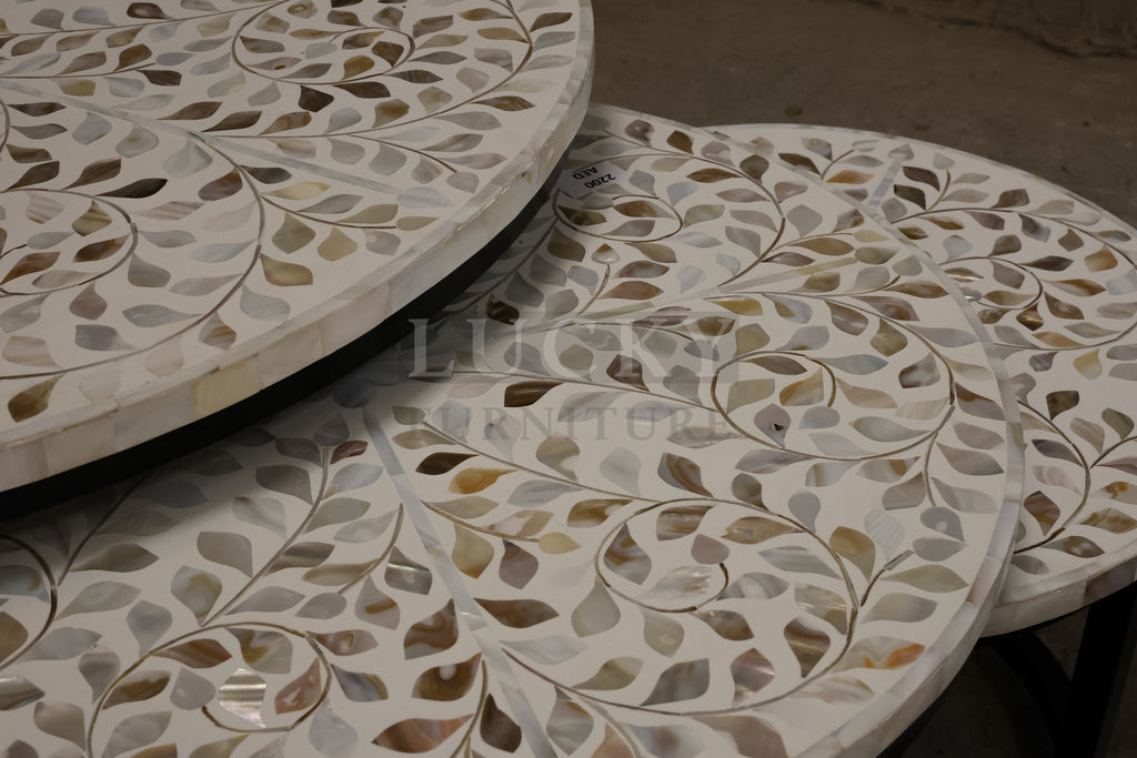 Mother of pearl inlay nesting table.