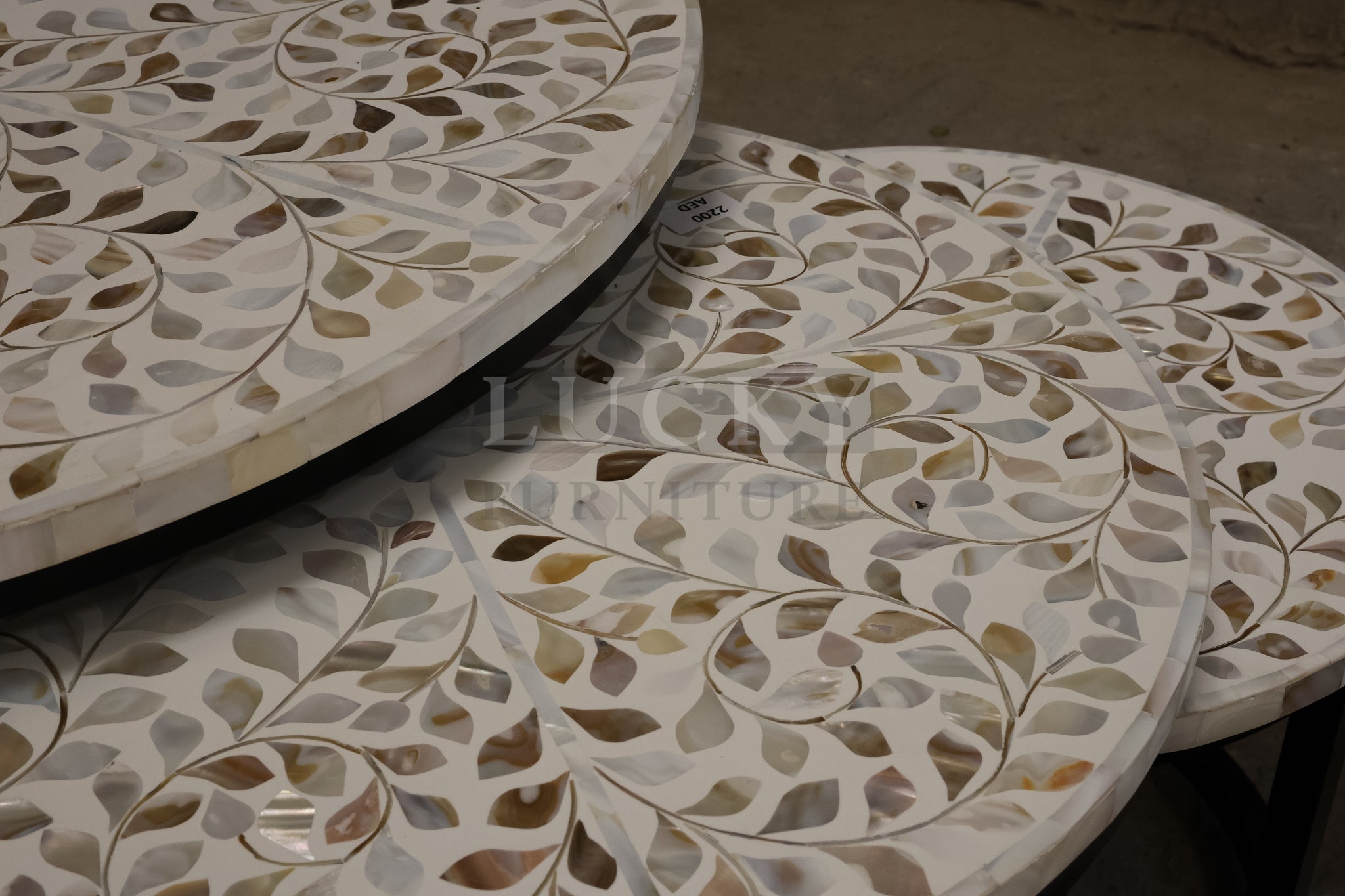 Mother of pearl inlay nesting table.