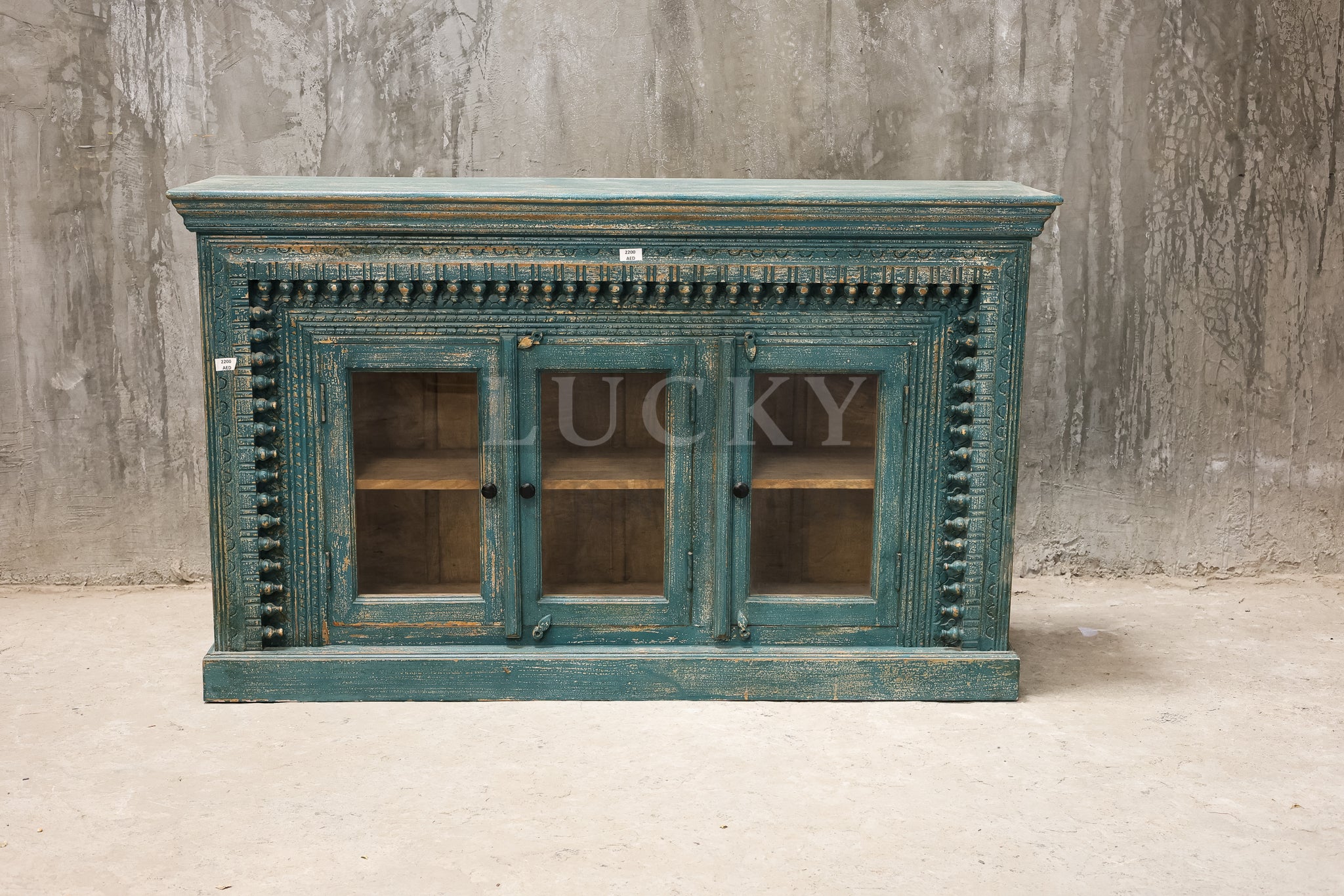 Carved glass door vibrant sideboard.