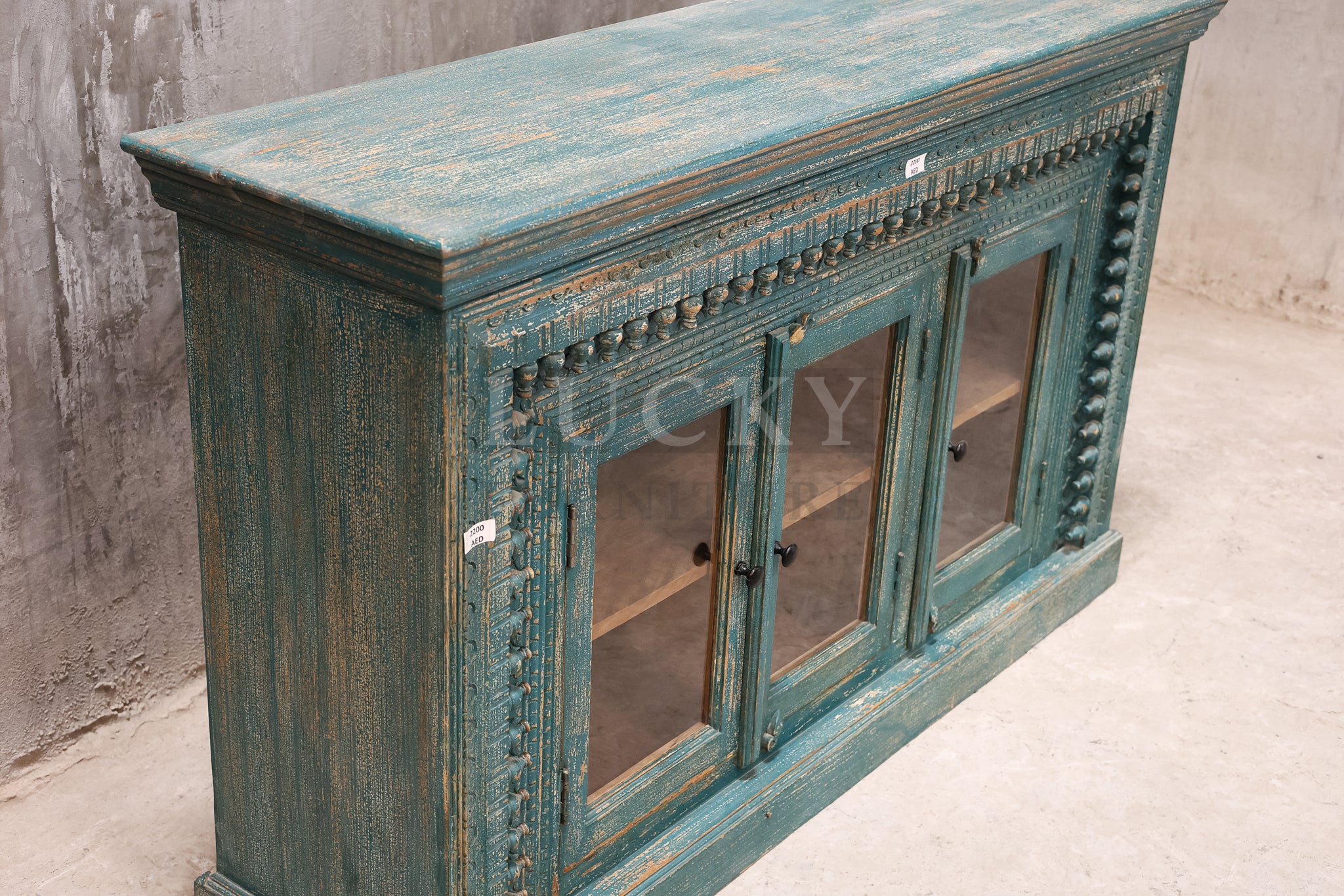 Carved glass door vibrant sideboard.