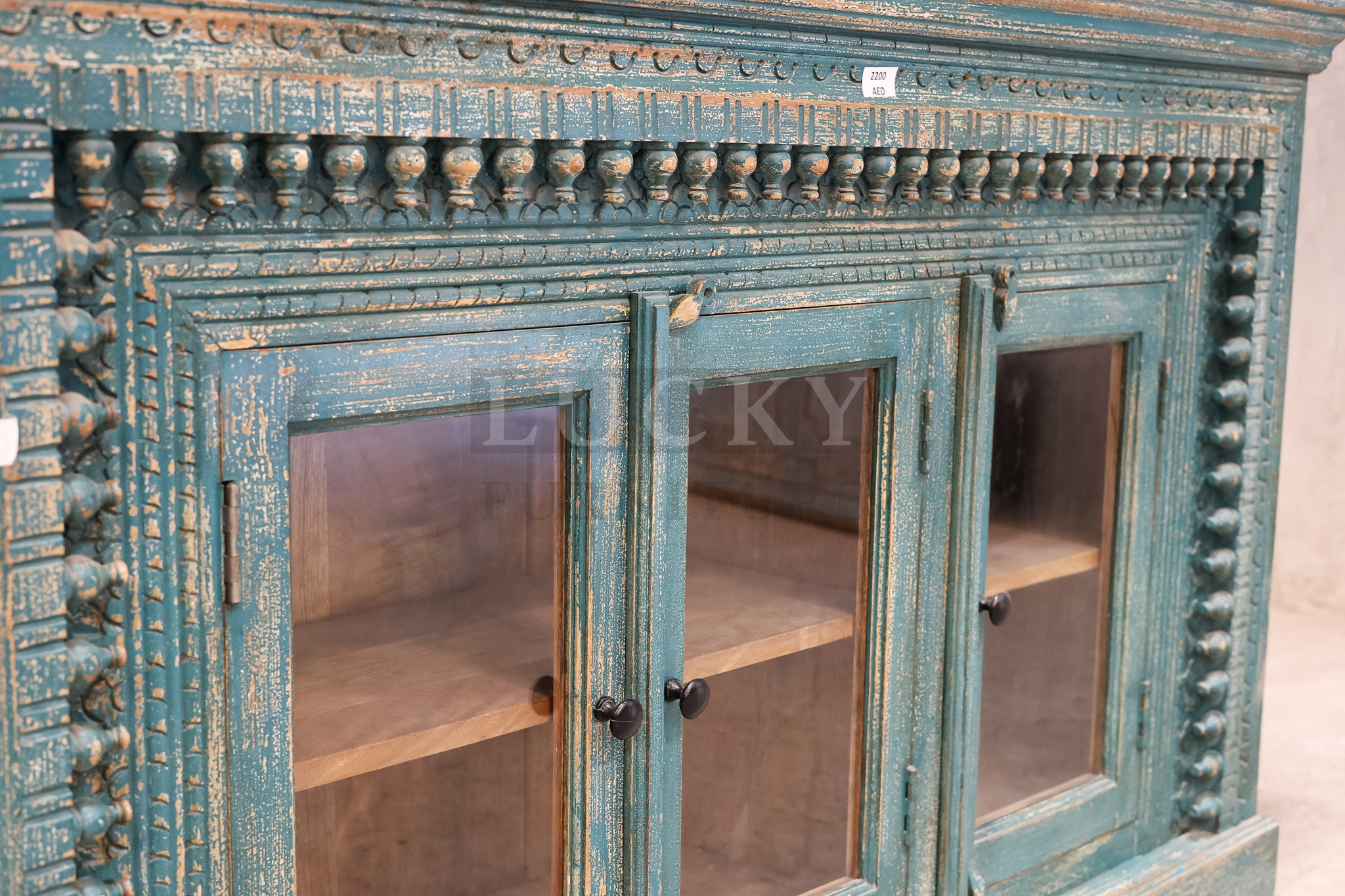 Carved glass door vibrant sideboard.