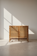 Mango wood and rattan sideboard.