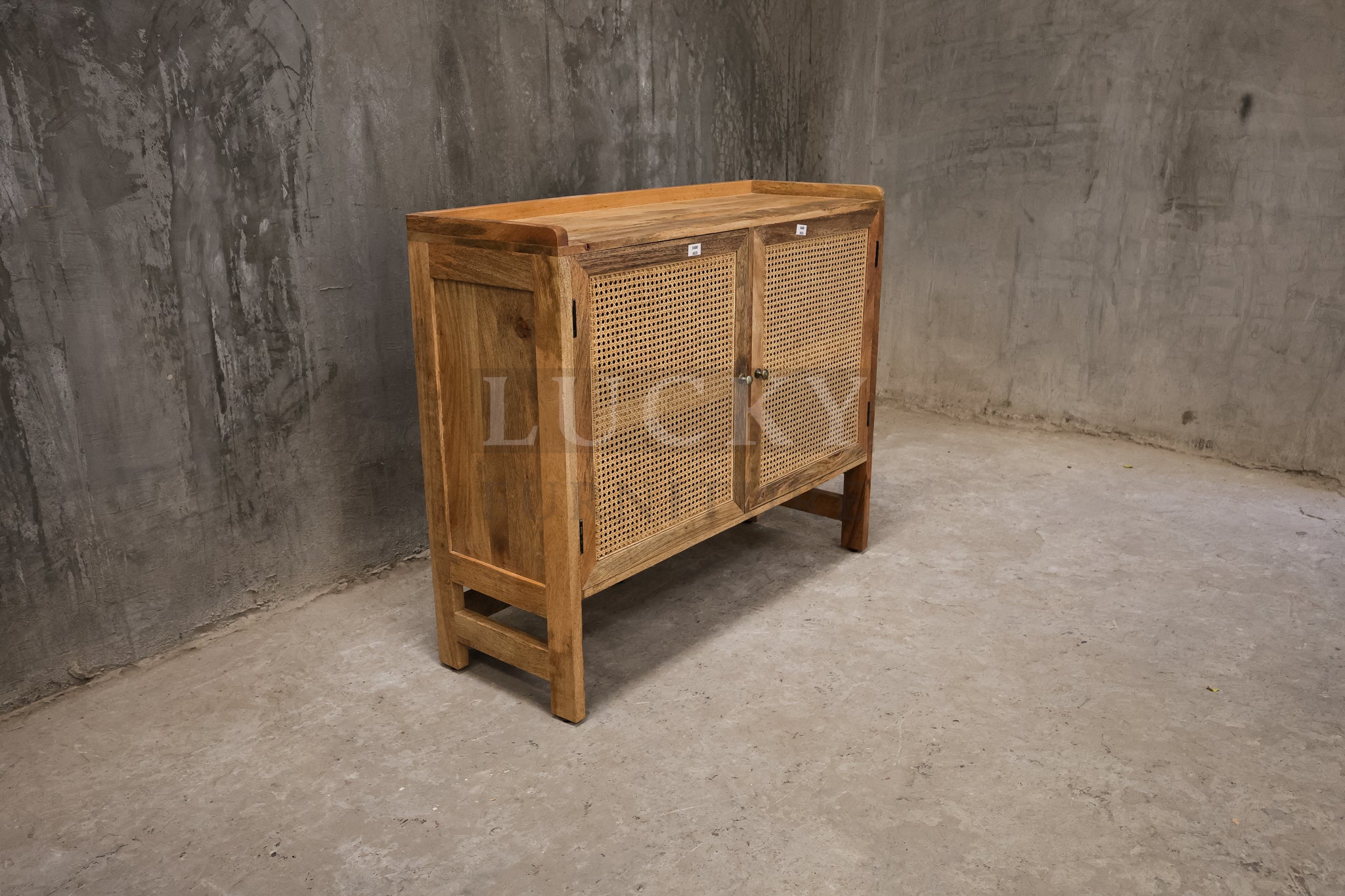 Mango wood and rattan sideboard.