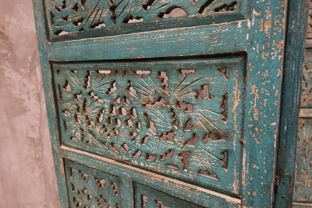 Vibrant carved room divider.