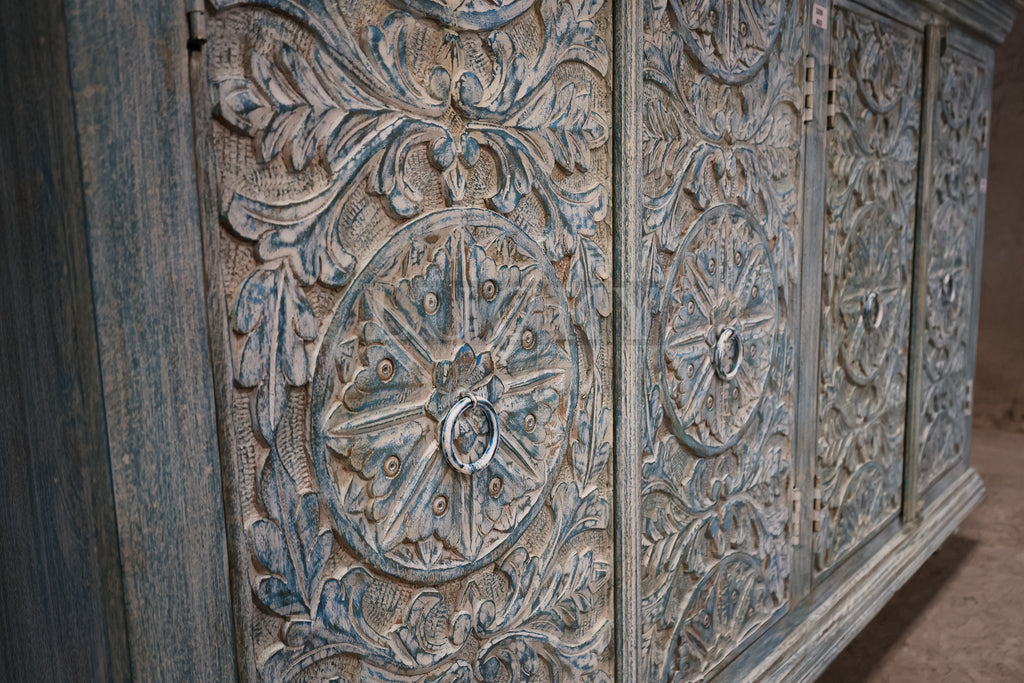 Vibrant sky blue carved sideboard.