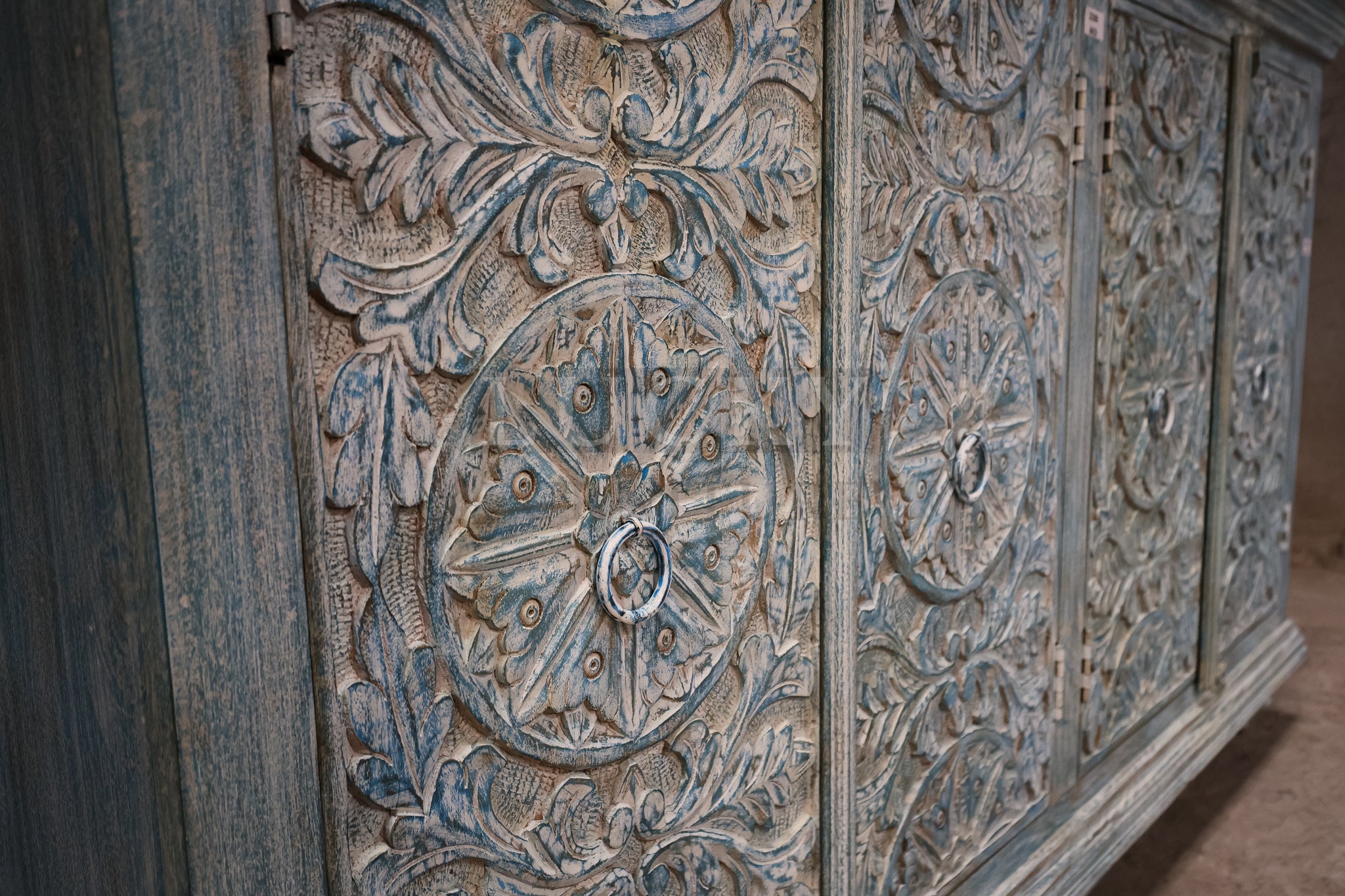 Vibrant sky blue carved sideboard.