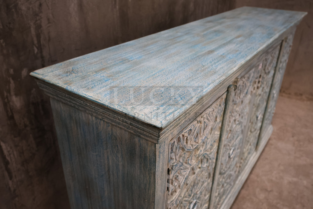 Vibrant sky blue carved sideboard.