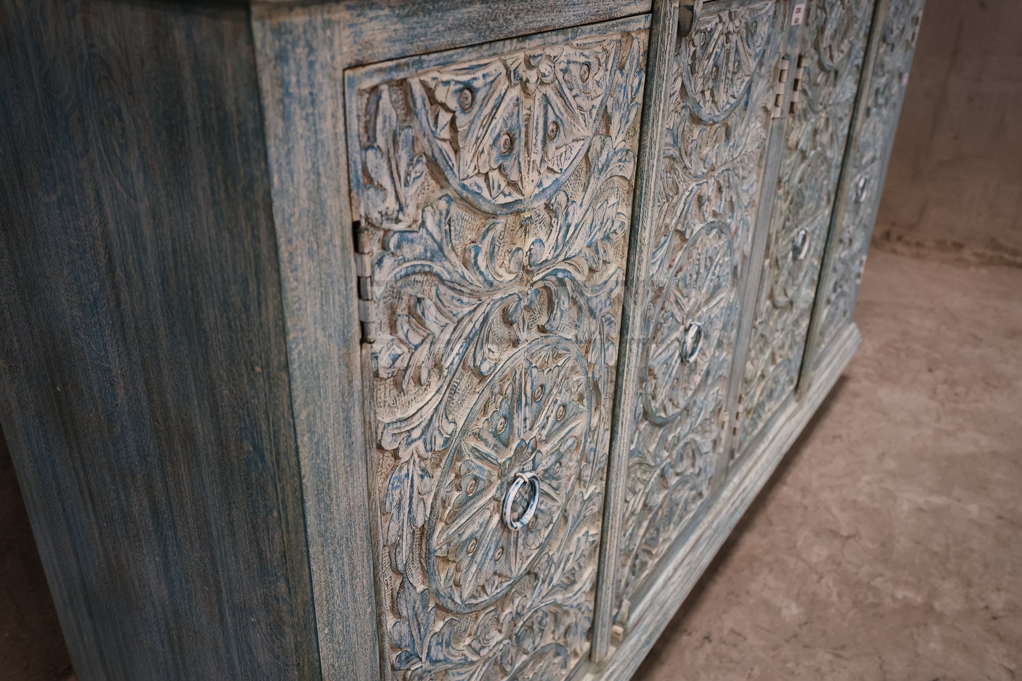 Vibrant sky blue carved sideboard.