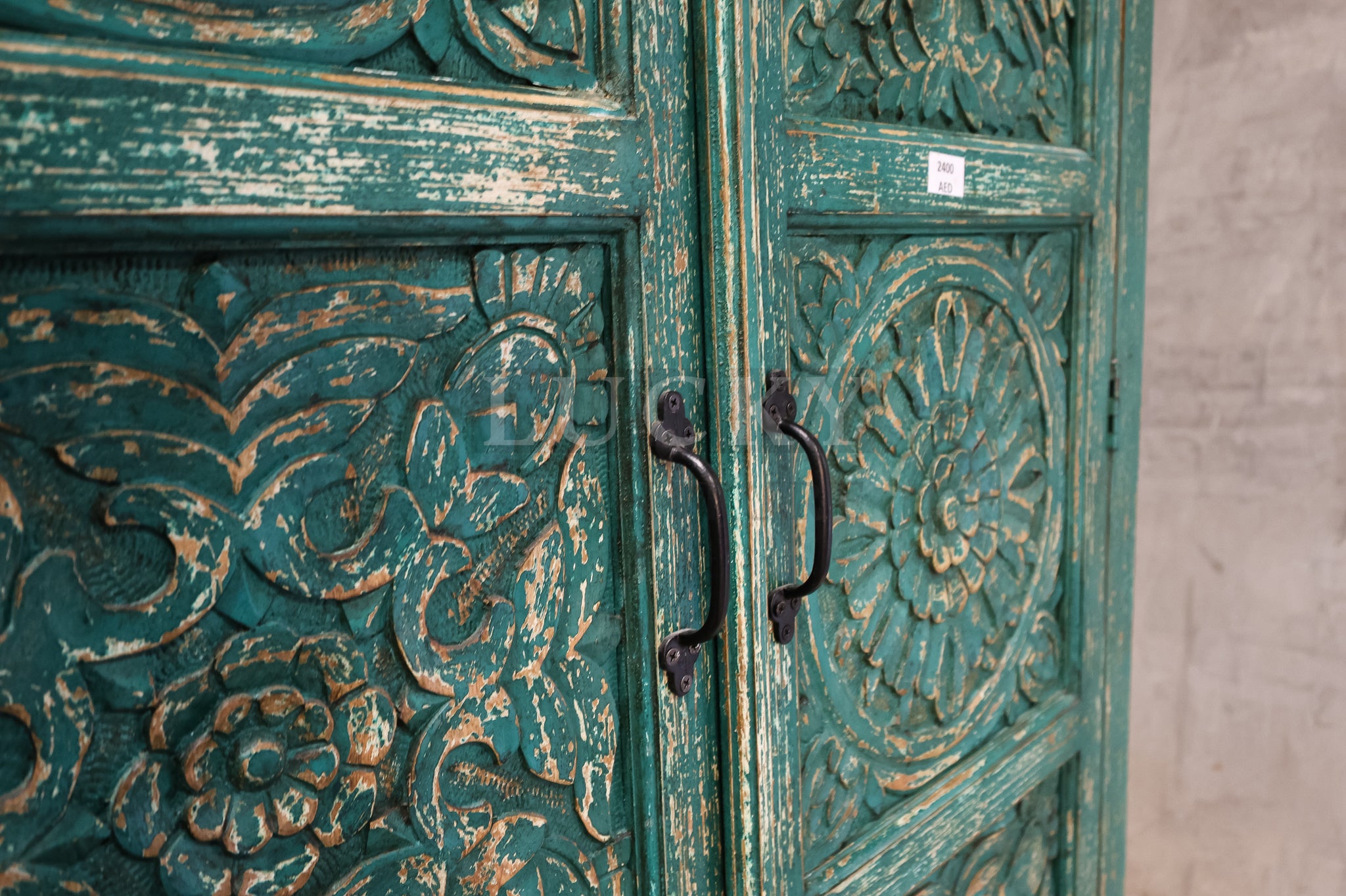 Carved vibrant cabinet.