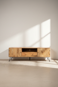 Mango wood tv stand with brass inlay and hair pin legs.