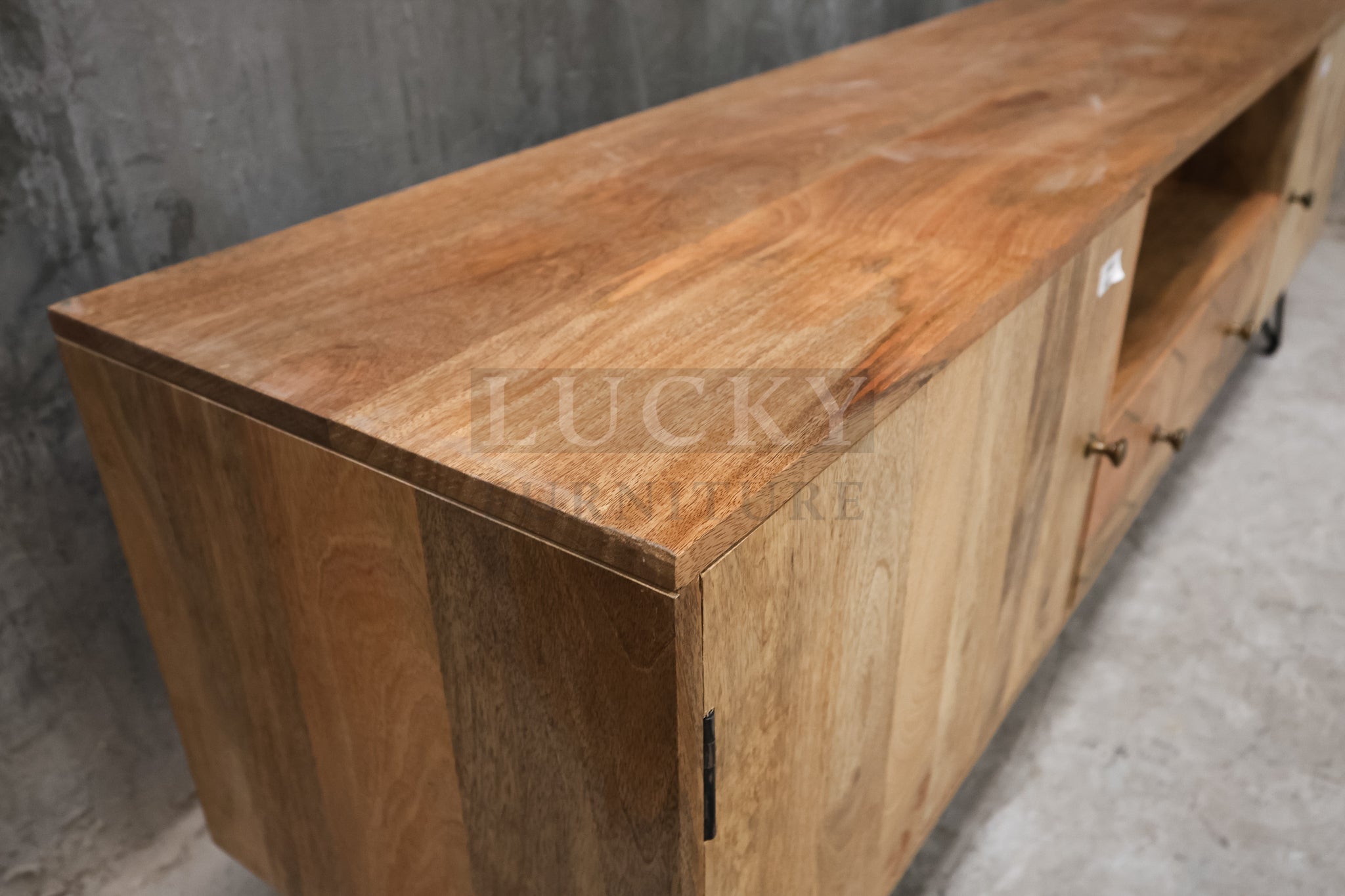 Mango wood tv stand with brass inlay and hair pin legs.