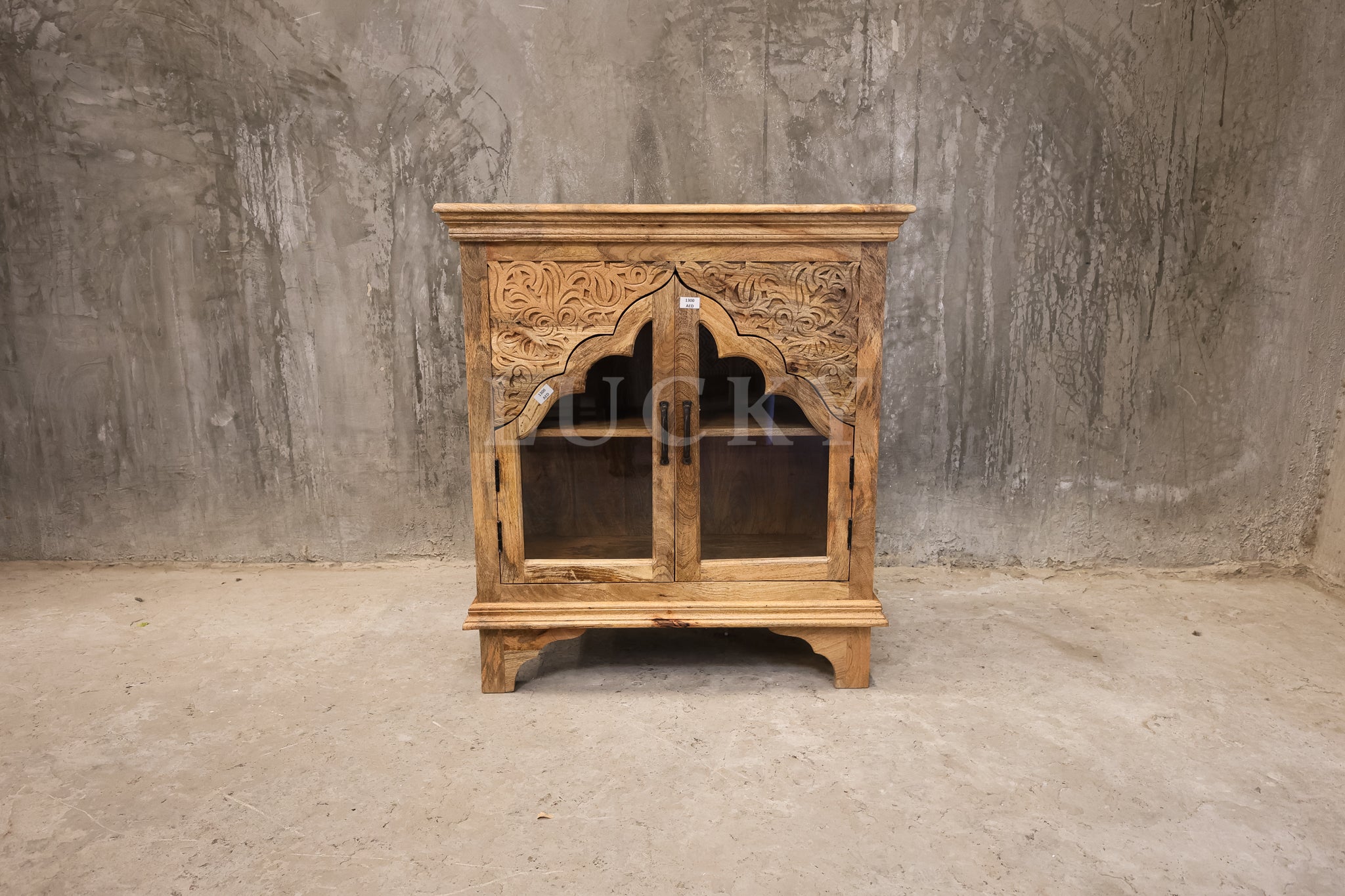 Carved mango wood glass door sideboard.