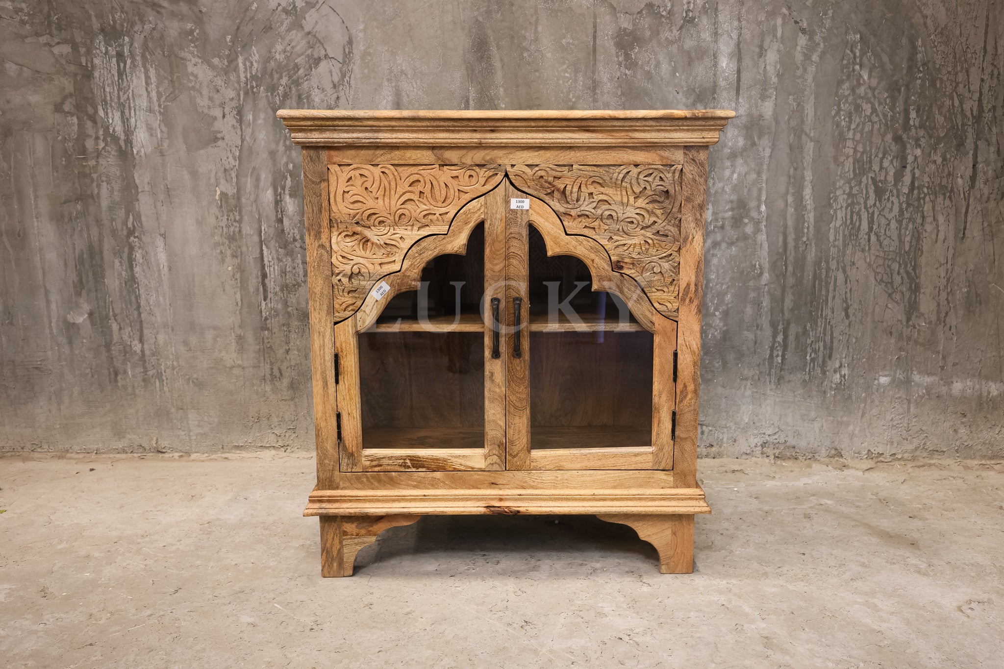 Carved mango wood glass door sideboard.