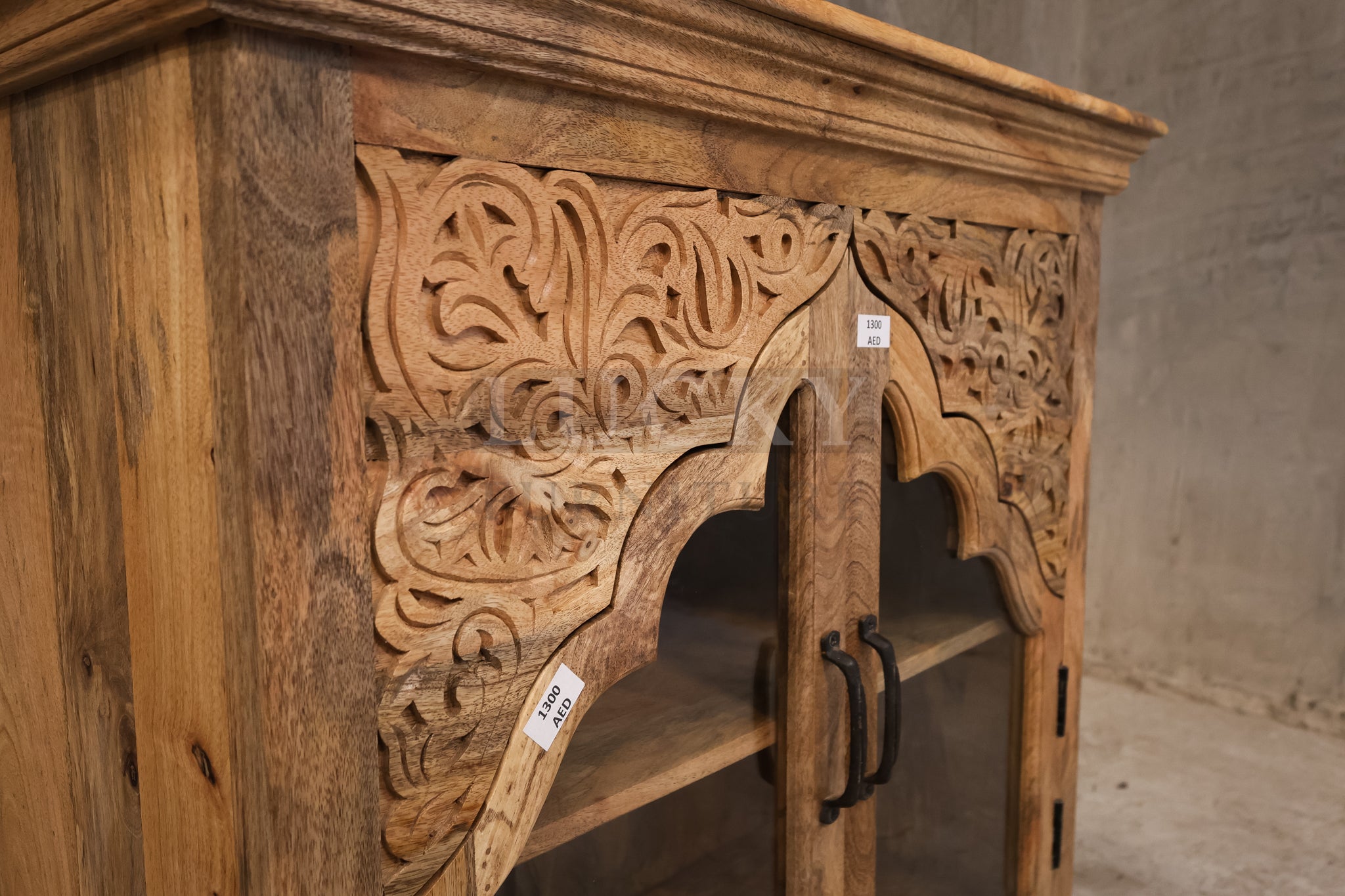 Carved mango wood glass door sideboard.