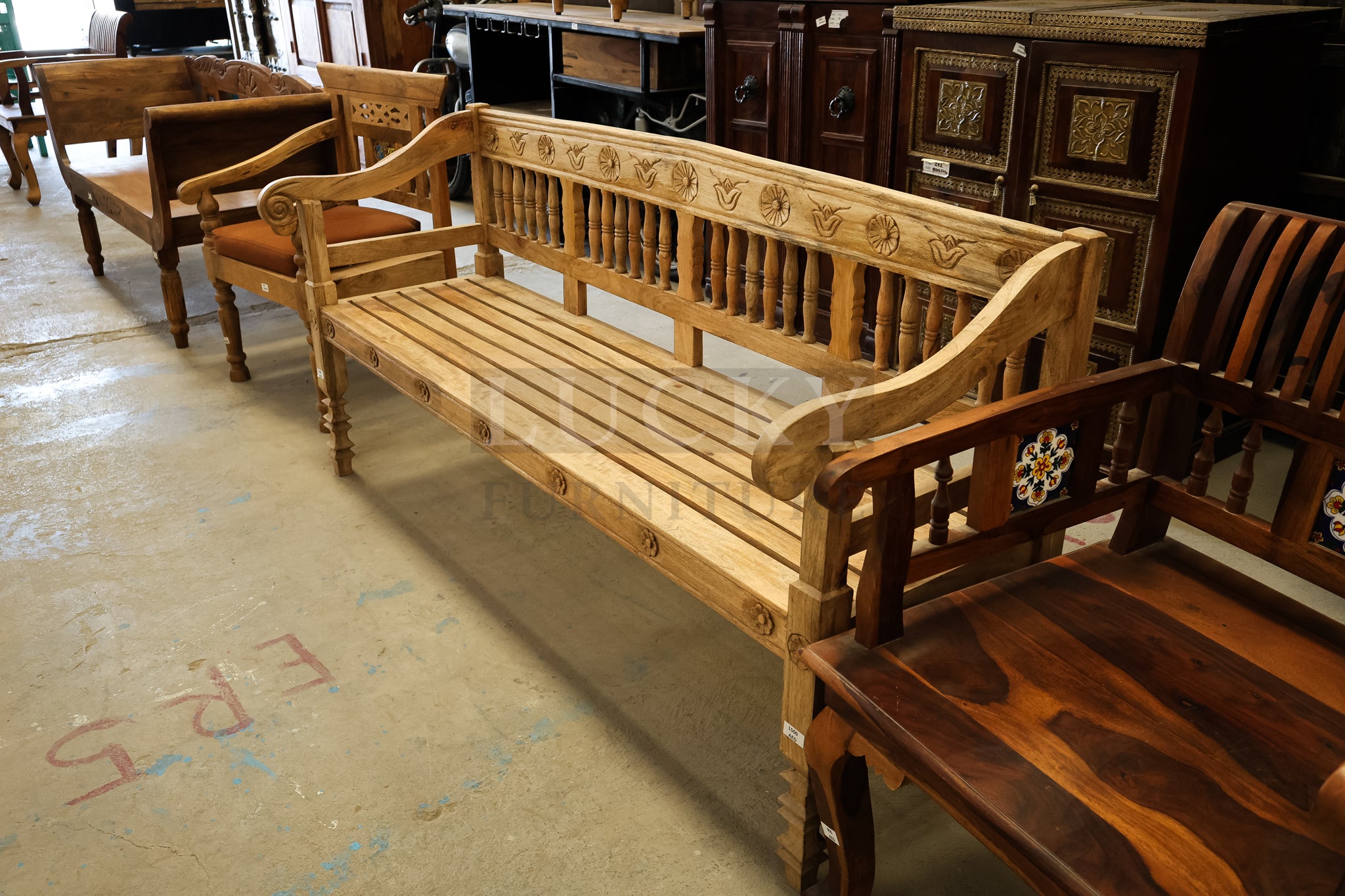 Mango wood bench with carving.