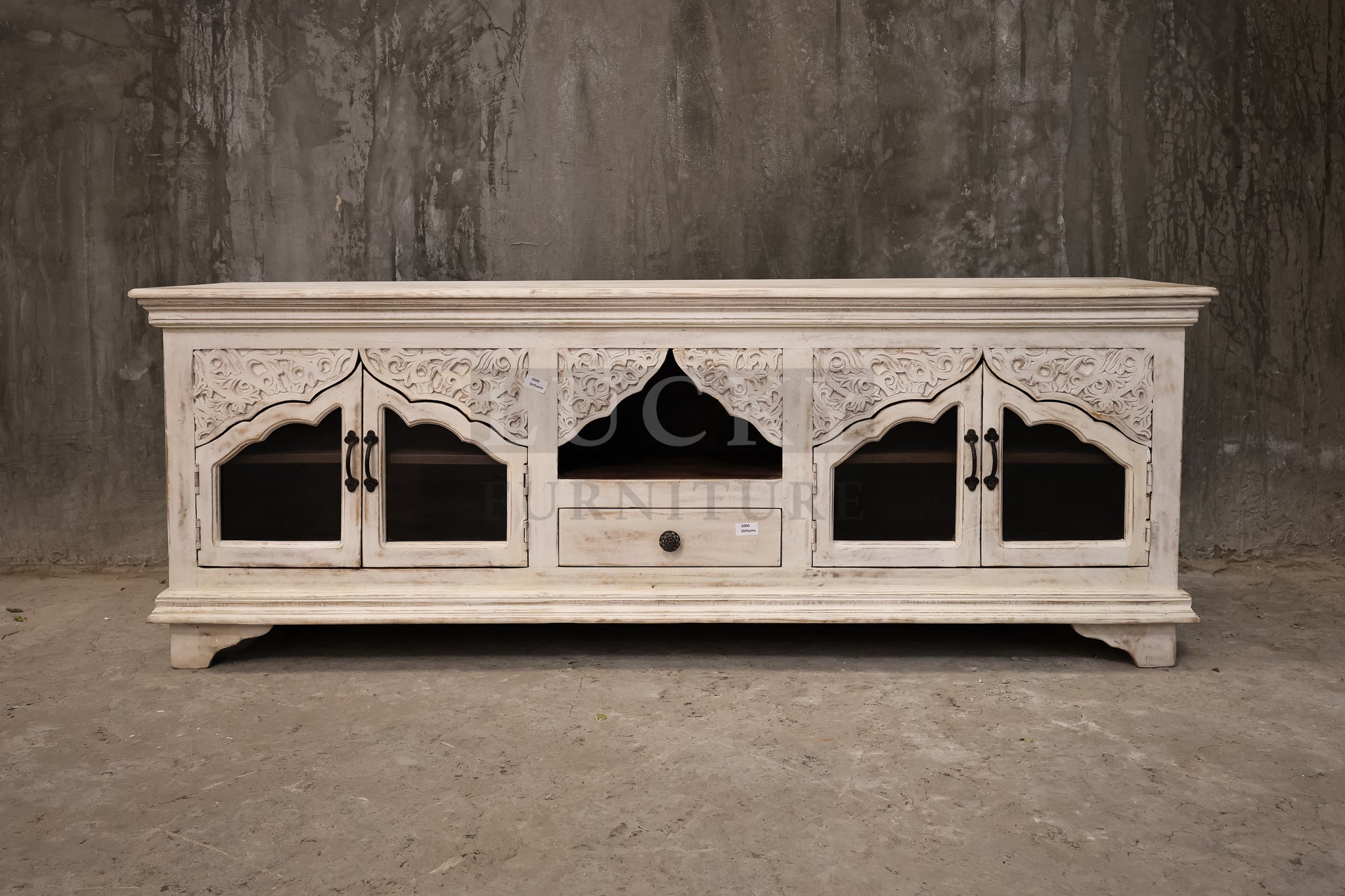Carved whitewashed tv stand.