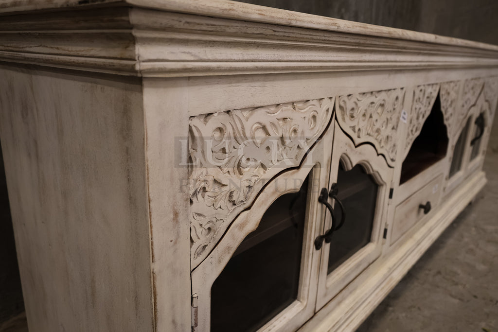 Carved whitewashed tv stand.