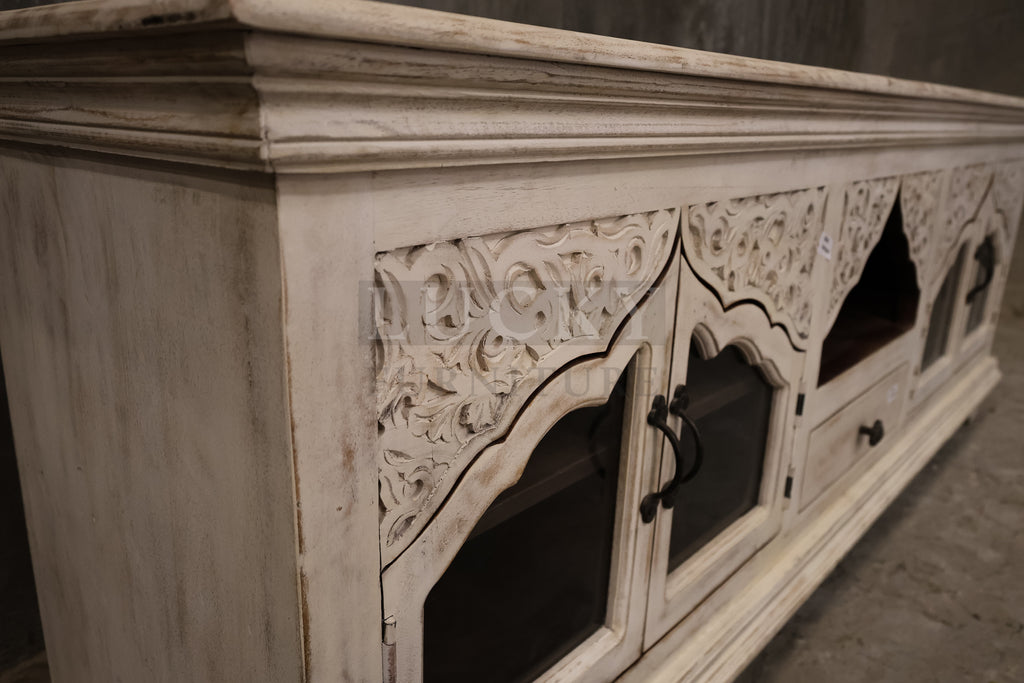 Carved whitewashed tv stand.