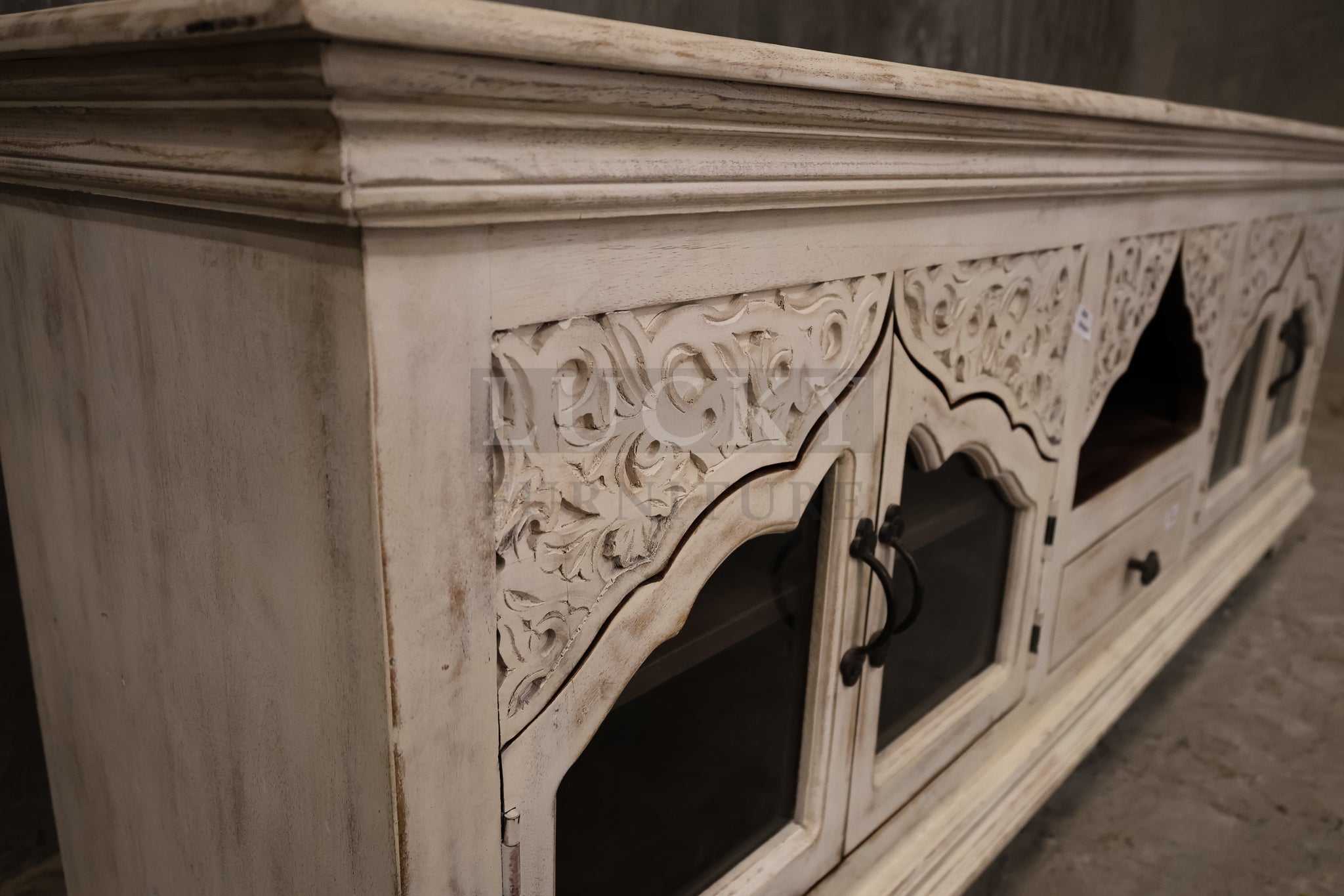 Carved whitewashed tv stand.