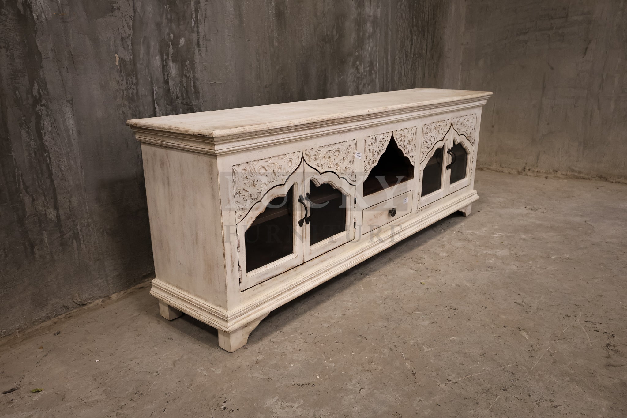 Carved whitewashed tv stand.