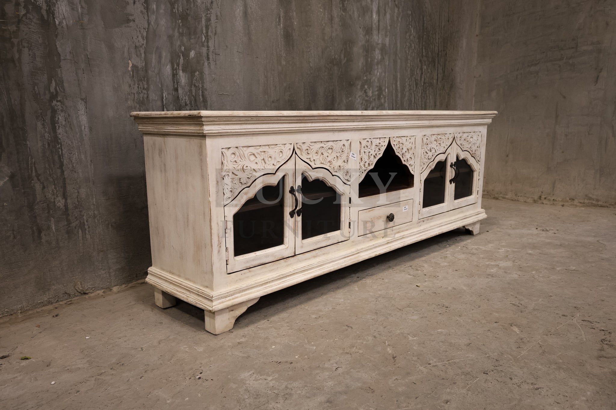 Carved whitewashed tv stand.