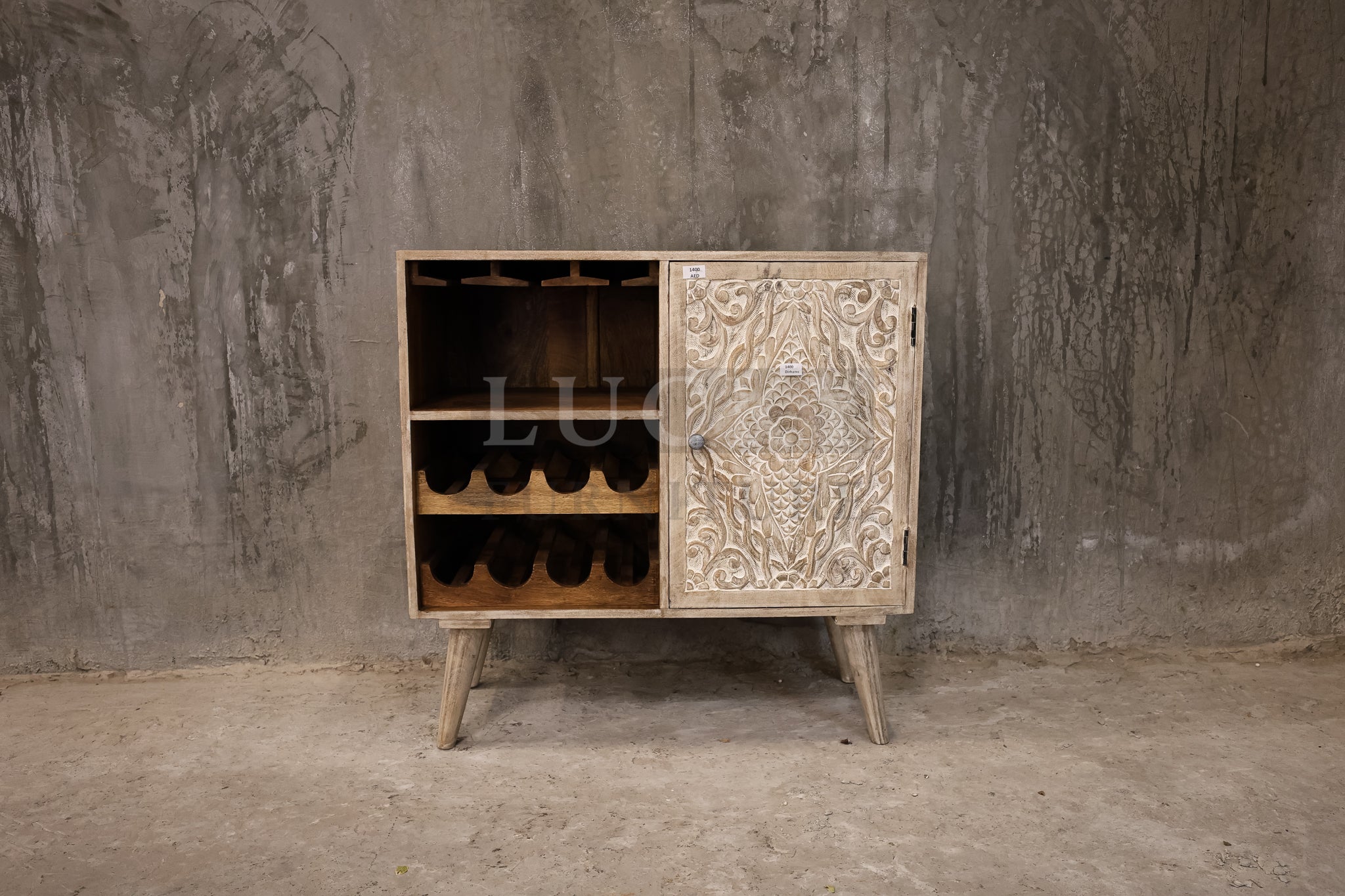Cavred whitewashed wooden bar.