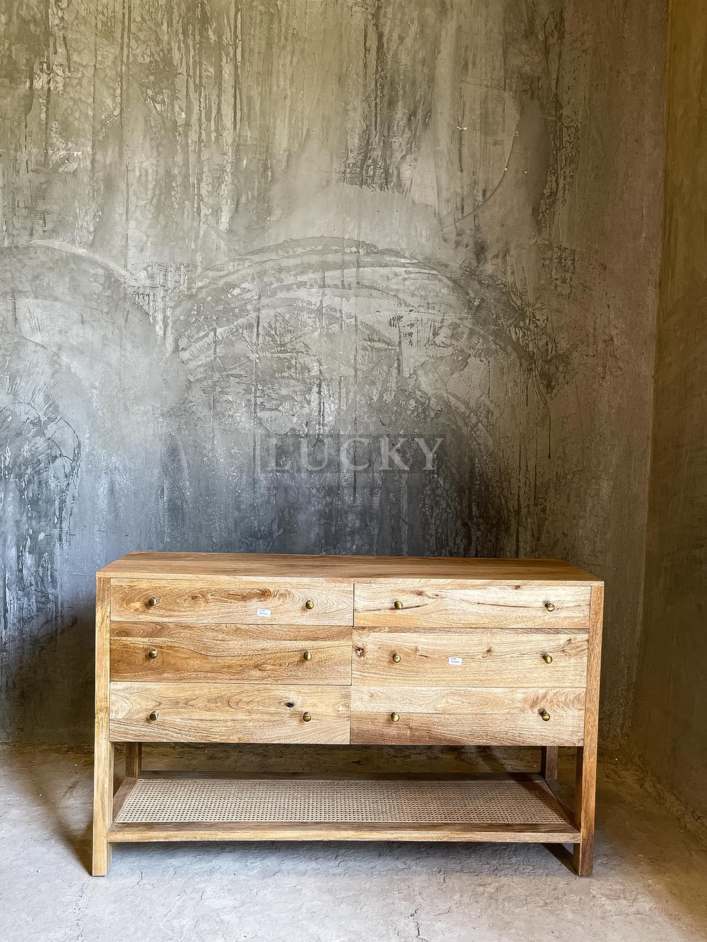 Mango wood 6 draw chest with rattan shelf