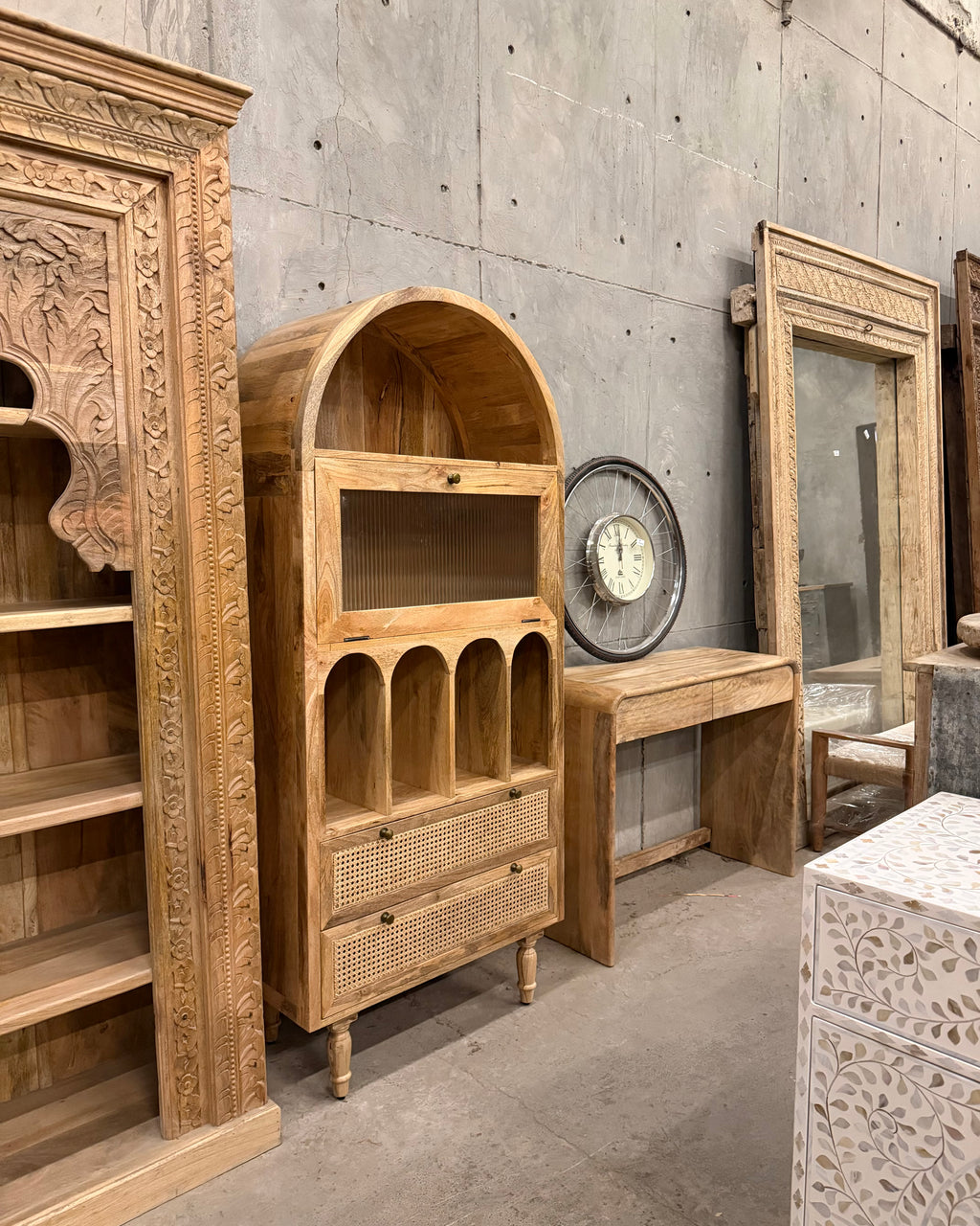 Arch rattan bookshelf with fluted glass.