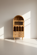 Arch rattan bookshelf with fluted glass.