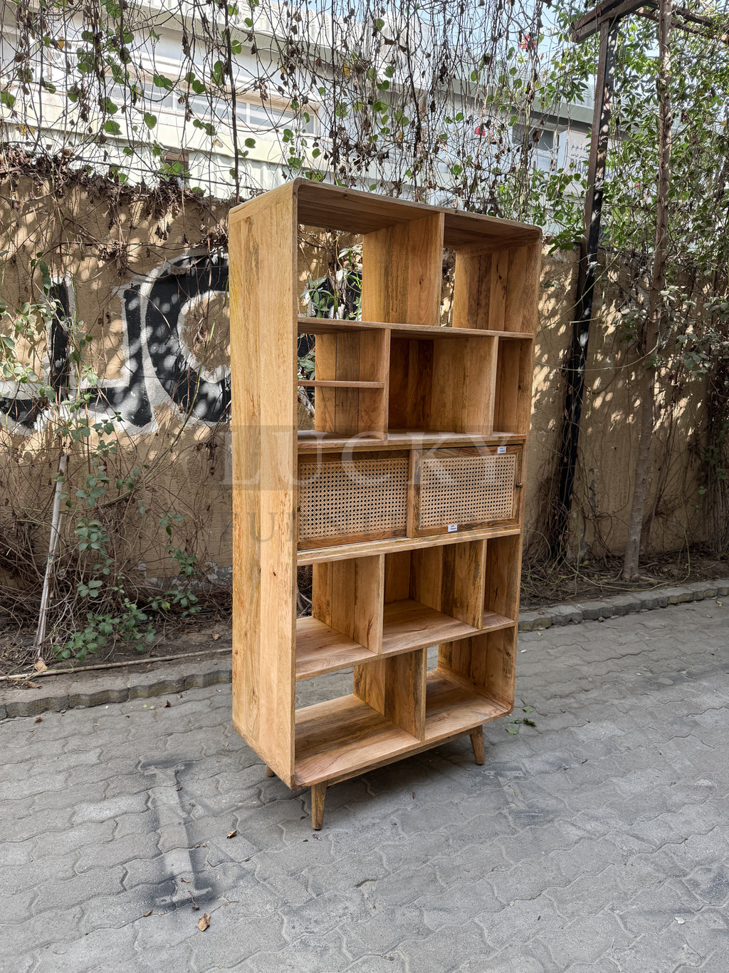 Rattan and mango wood bookshelf