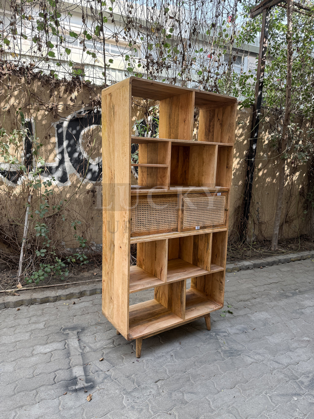 Rattan and mango wood bookshelf