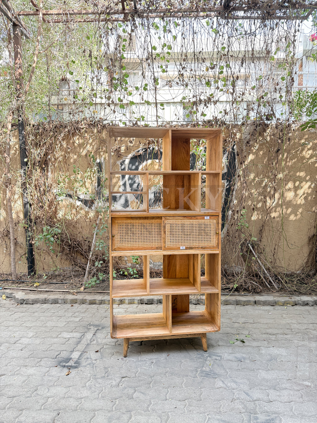 Rattan and mango wood bookshelf