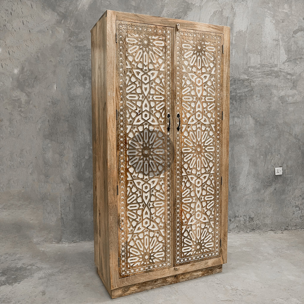 Carved cabinet with white painted inlay.