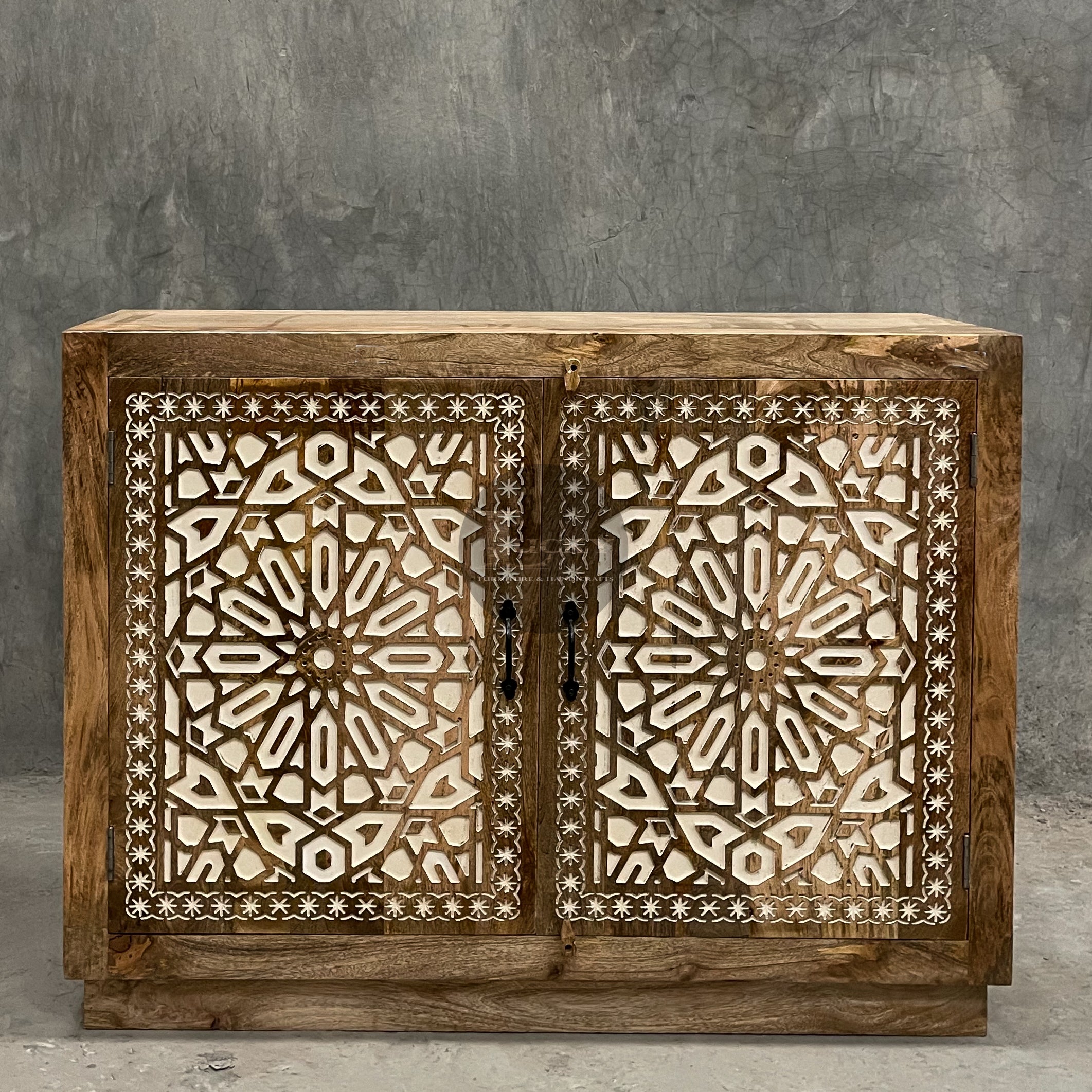 Carved sideboard cabinet with white painted inlay.